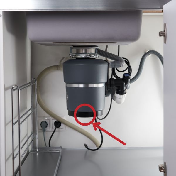 unclog your garbage disposal by inserting a hex tool in the bottom of the unit and turning